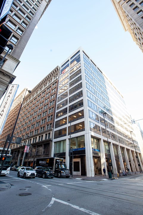 an office building on the corner of a city street