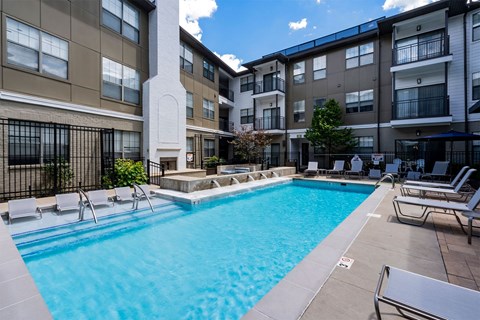 our apartments have a large pool and lounge chairs