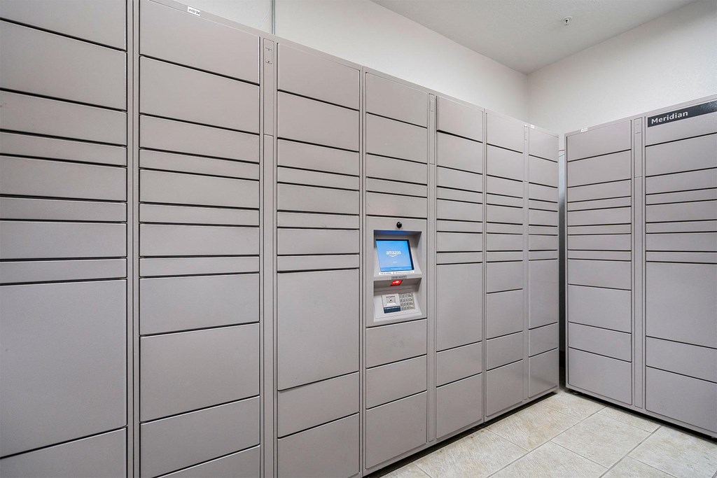 a bunch of stainless steel lockers in a room