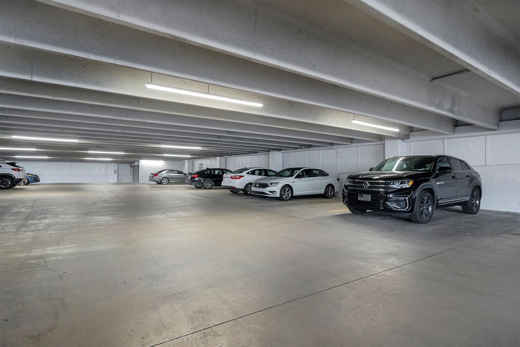 a parking garage with cars parked in it