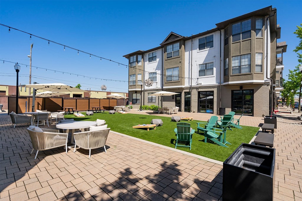 our apartments have a large patio with tables and chairs