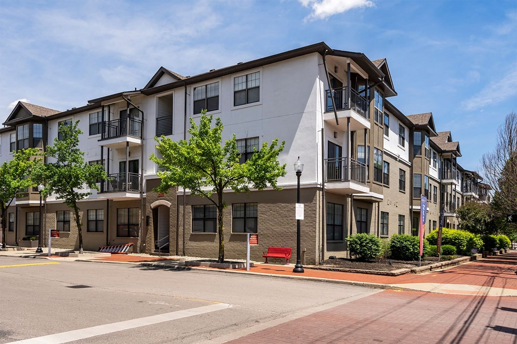 an apartment building on the corner of a street
