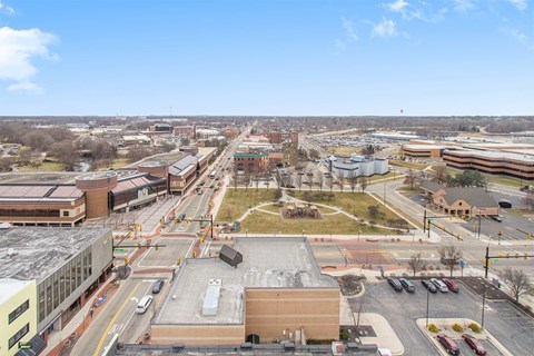 A city street with cars and buildings.