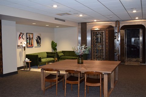 A conference room with a long table and chairs.