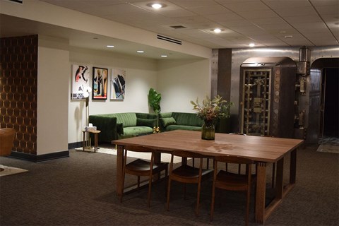 A conference room with a long table and chairs.