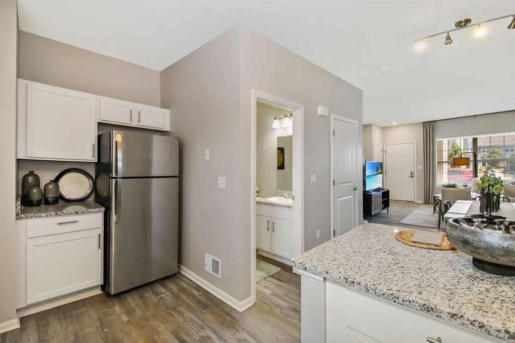 a kitchen with stainless steel appliances and granite counter tops