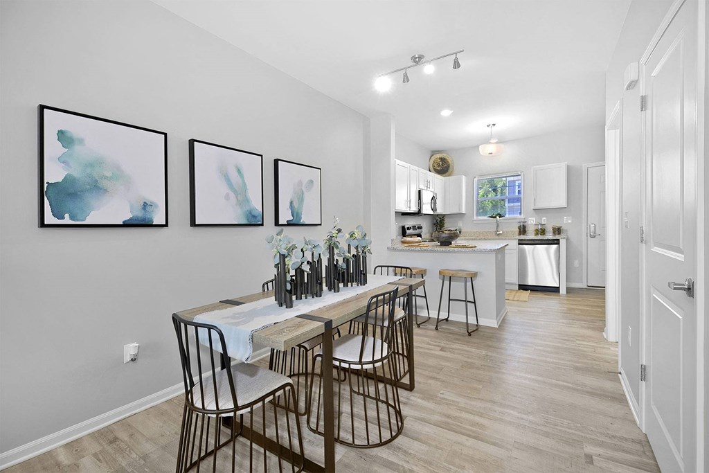 a dining room with a table and chairs