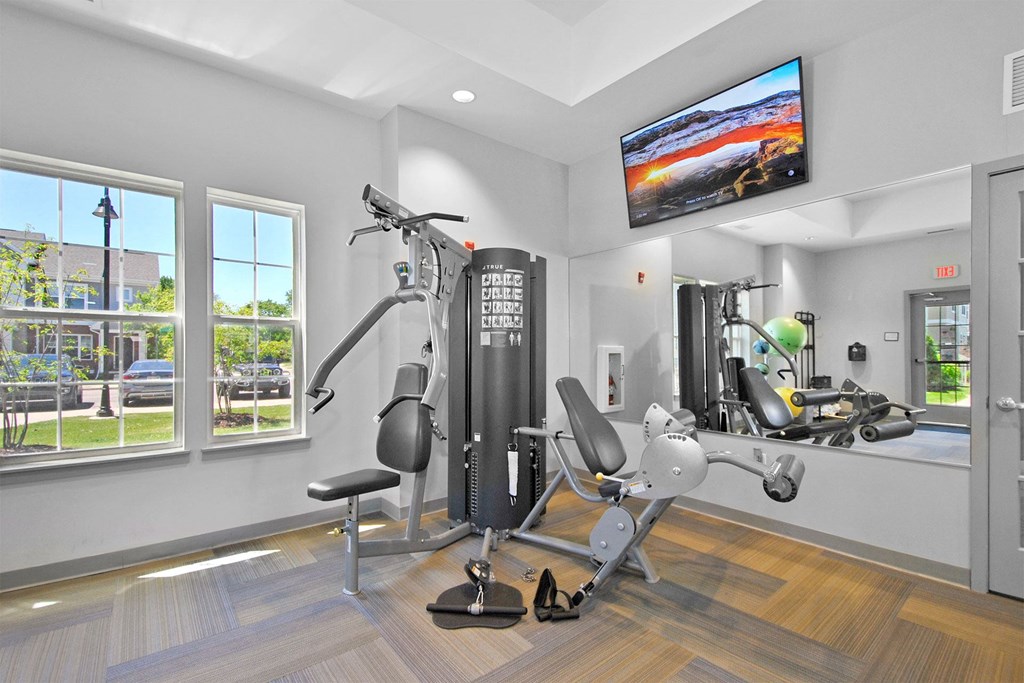 the gym at the district flats apartments in lenexa