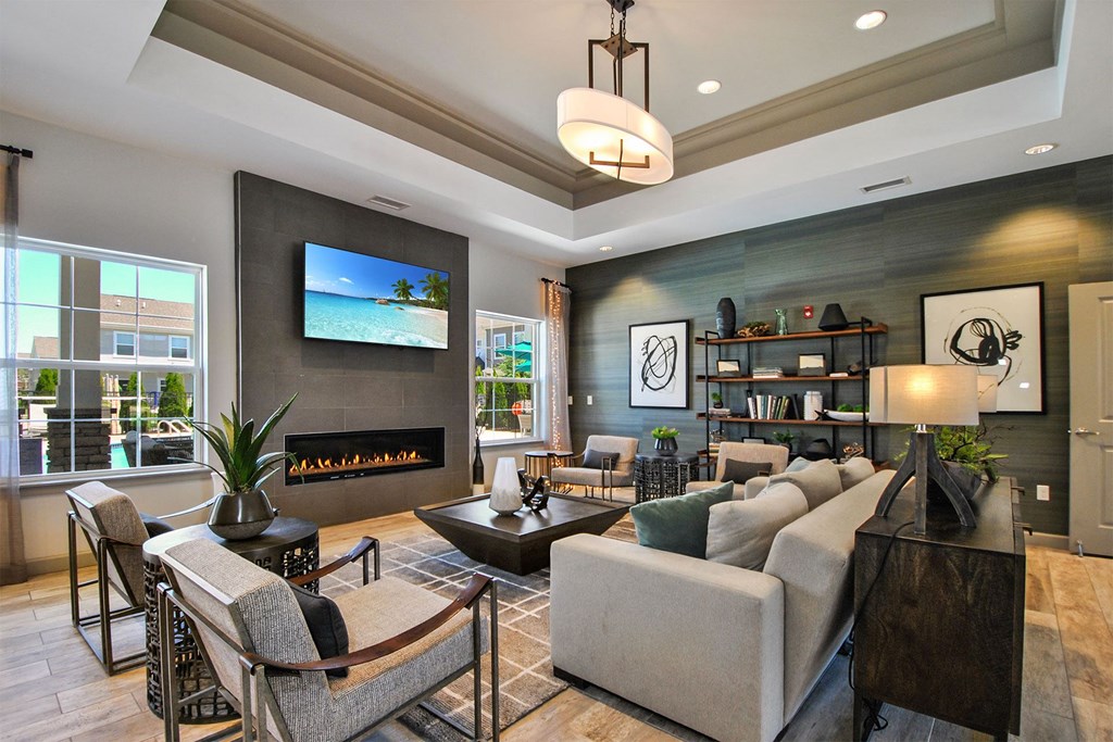 a living room with couches and chairs and a fireplace