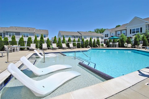 our apartments have a resort style pool with chaise lounge chairs