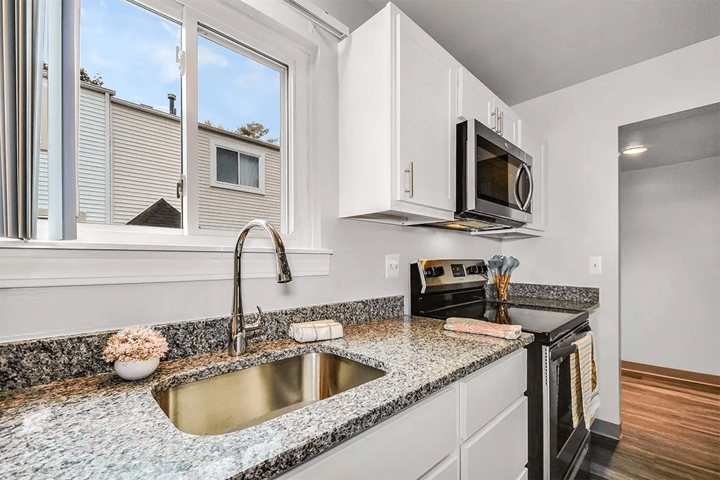 kitchen with granite countertops and stainless steel appliances