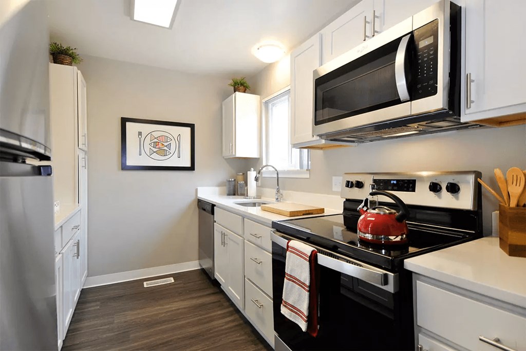 kitchen with white countertops and stainless steel appliances