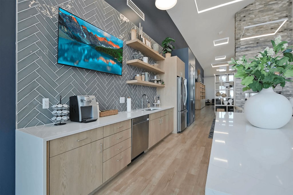 clubroom with kitchen and tv