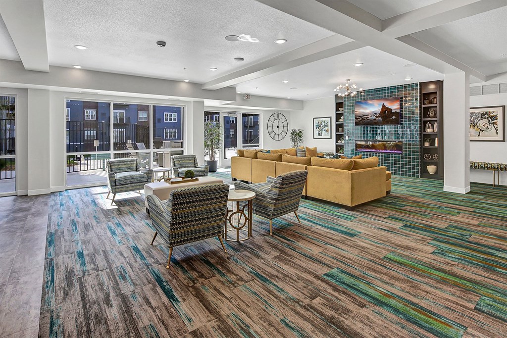 a living room with couches and chairs and a fireplace
