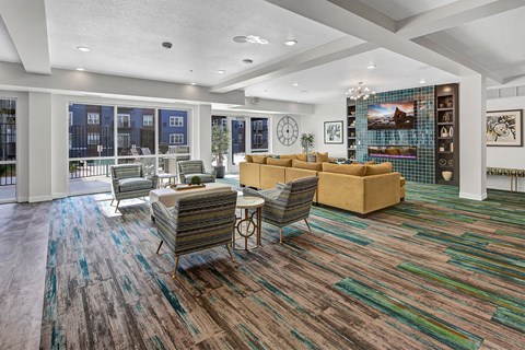 a living room with couches and chairs and a fireplace