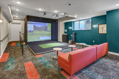 a workout room with a ping pong table and a window overlooking a golf course