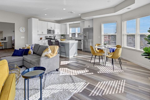 a living room with a couch and a table with chairs