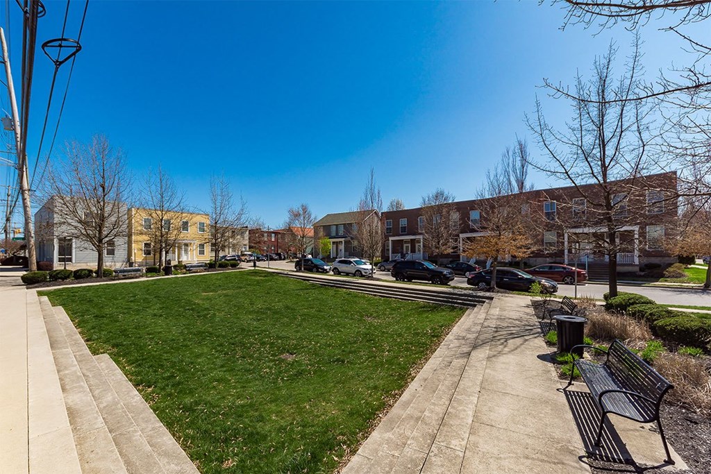 A park with a bench and a pathway.