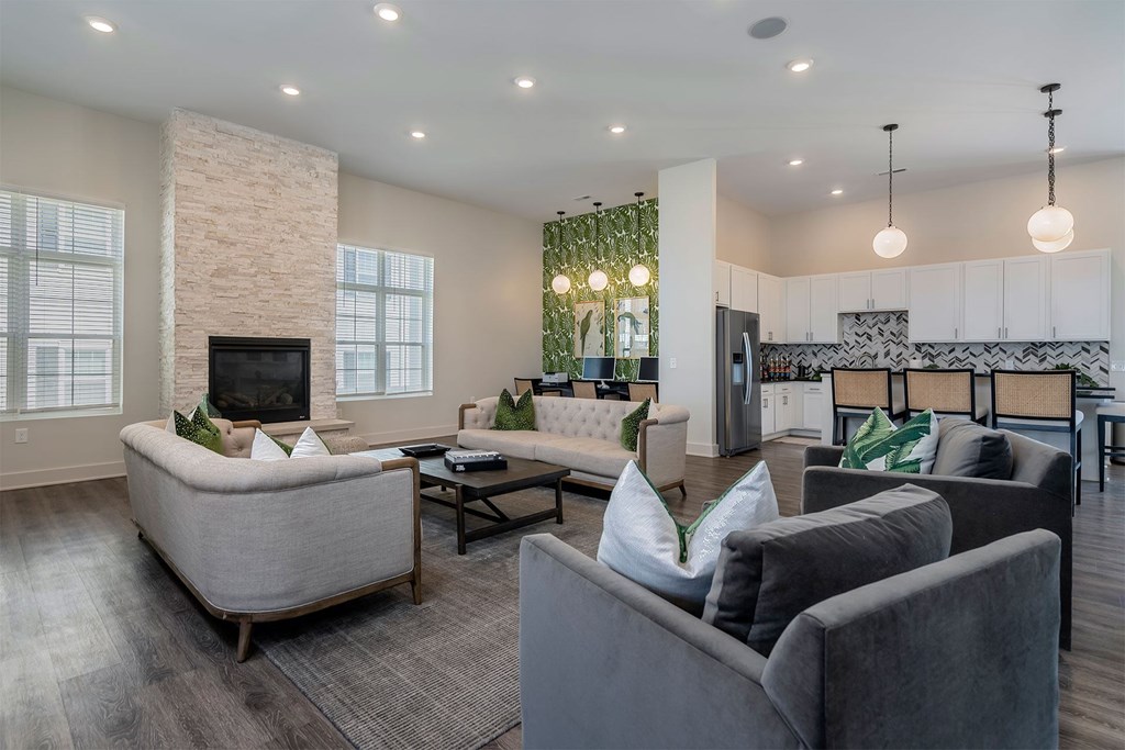 A modern living room with a fireplace and a dining area.