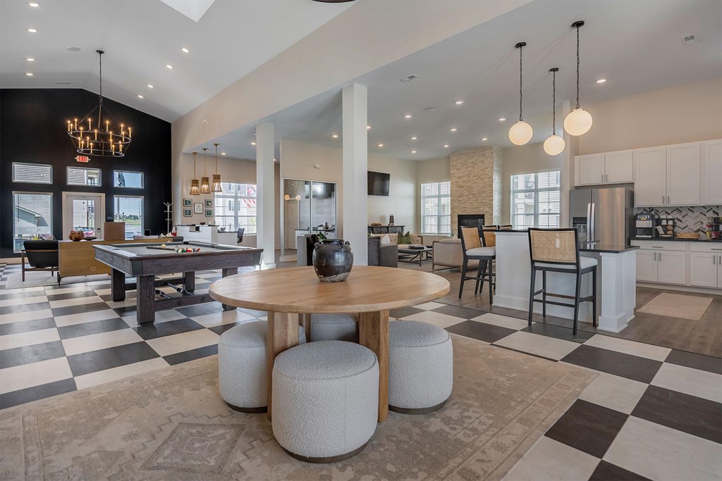 A modern kitchen with a black and white checkered floor.