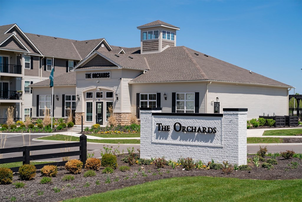 The Orchards is a residential complex with a sign in front.