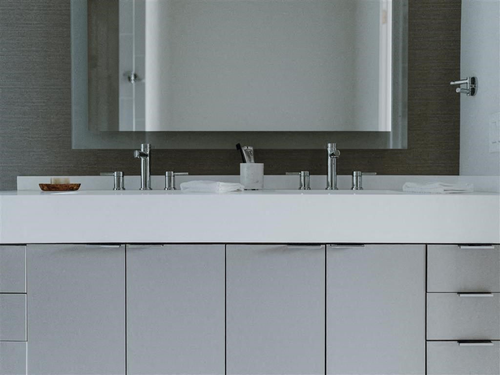 a bathroom with a sink and a mirror