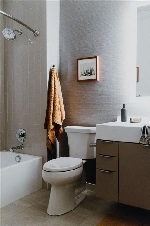 a bathroom with a toilet sink and bathtub