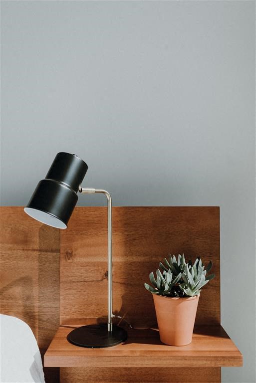 a lamp sitting on top of a wooden table