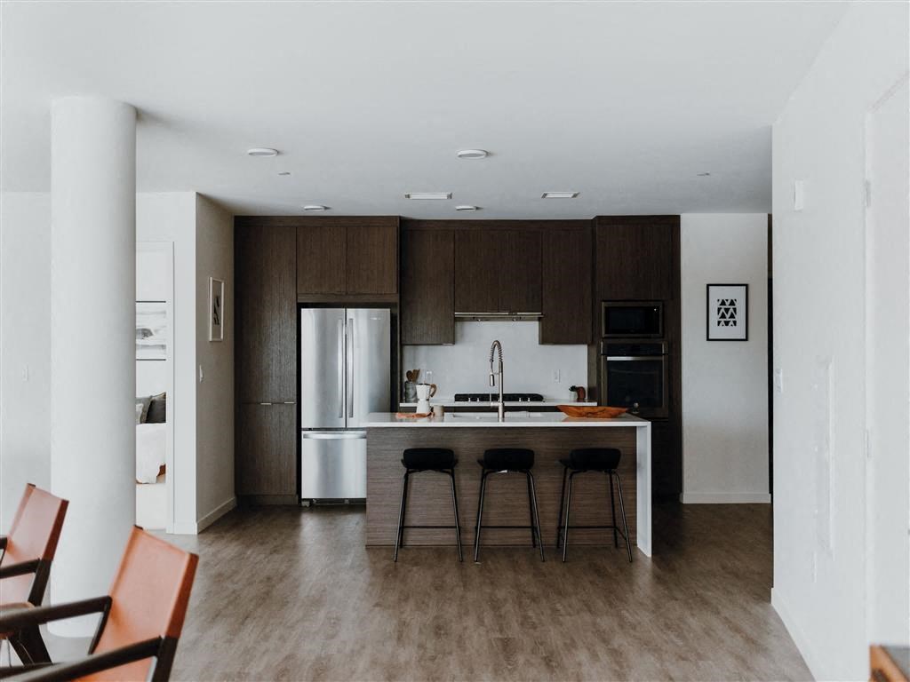 a kitchen with a center island and a stove top oven