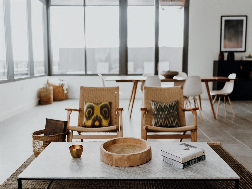 a room filled with furniture and a large window