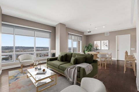 A living room with a green couch and a coffee table.