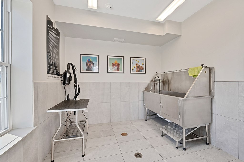 A kitchen with a sink and a table.