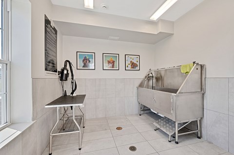 A kitchen with a sink and a table.