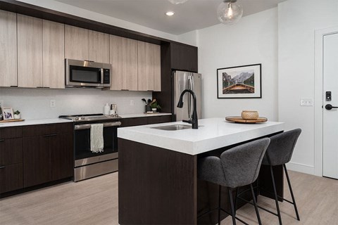 a kitchen with a sink and a counter top