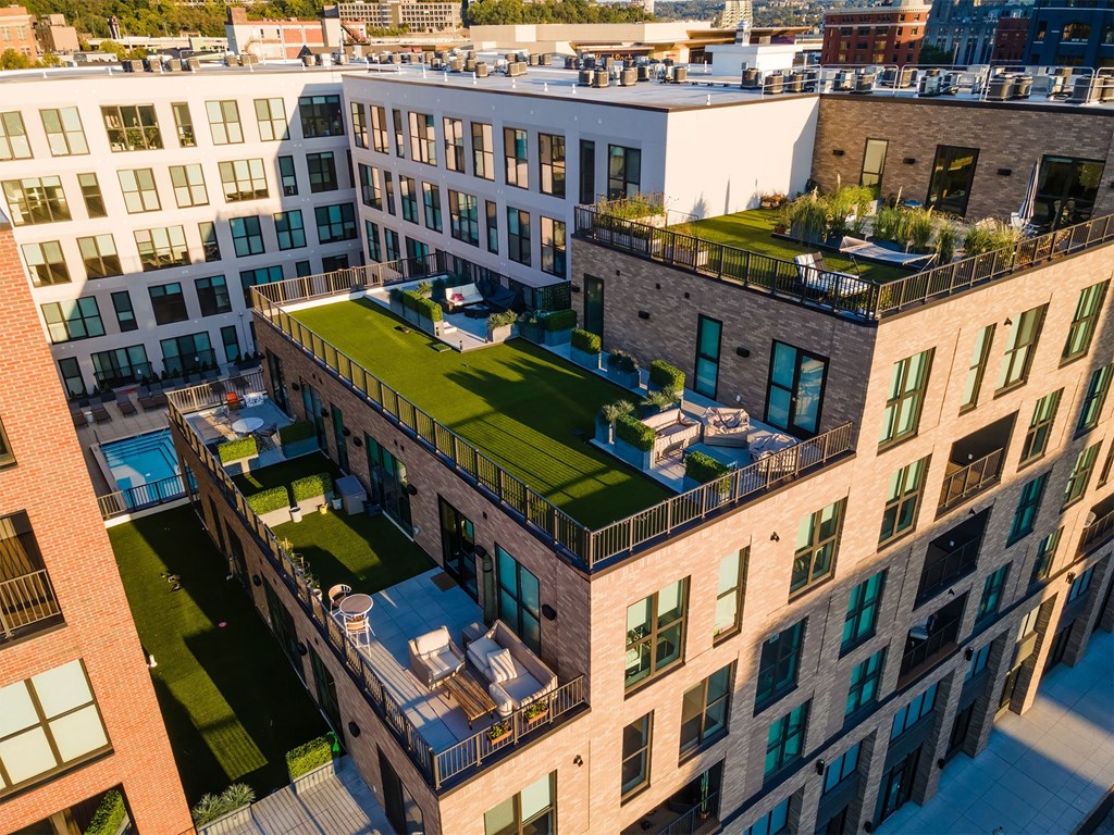 an aerial view of a building with a green roof