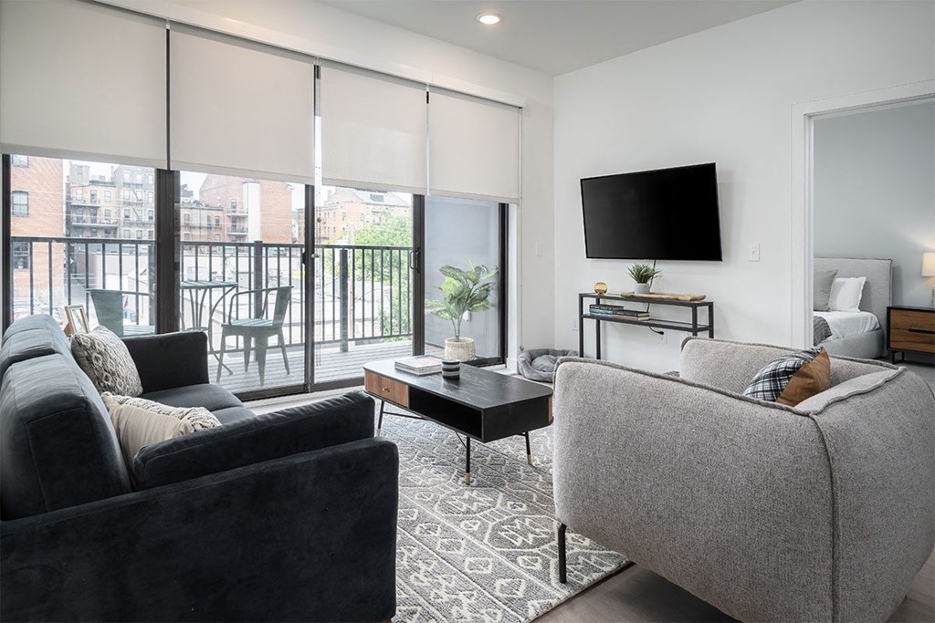a living room with a couch and a tv