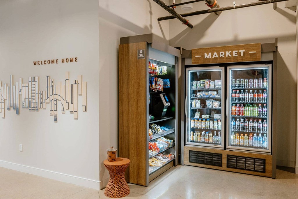 the store has a large refrigerator and drinks in the corner of the room