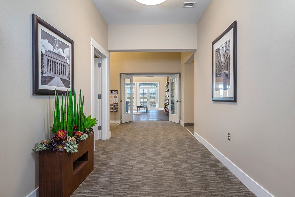 clubhouse hallway with art on walls