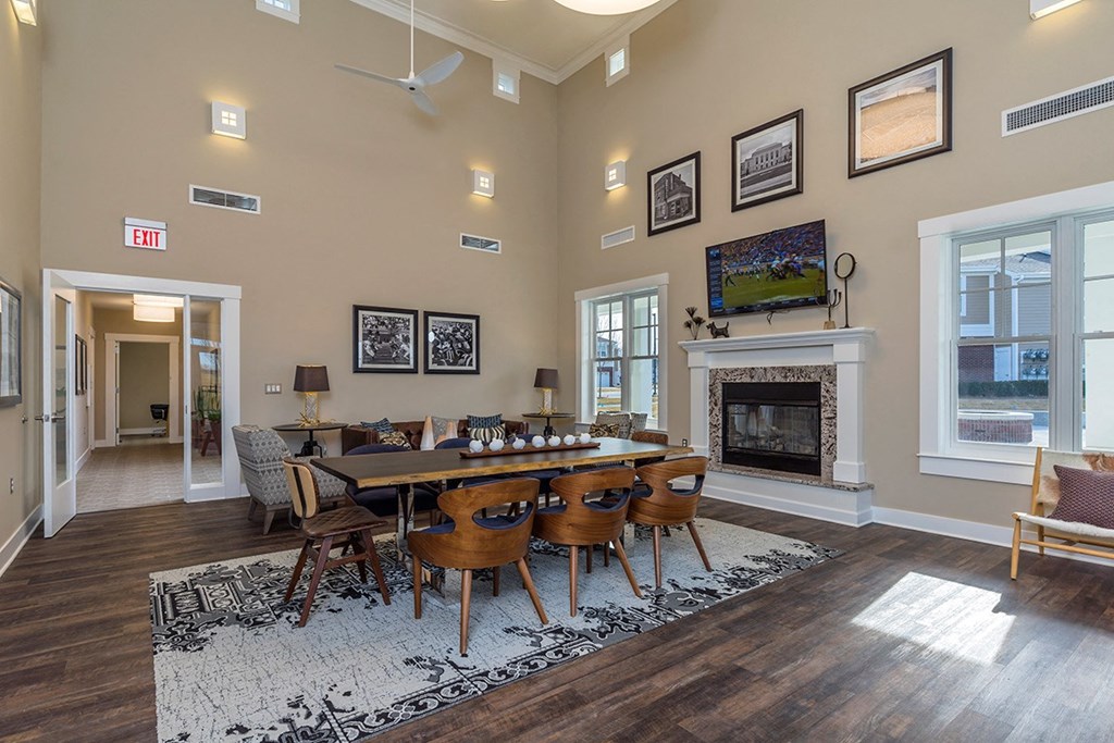 a dining room with a table and chairs and a fireplace