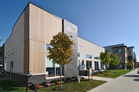 A modern building with a tree in front of it.