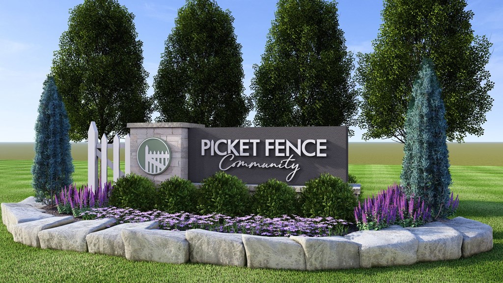 A sign that says Pickett Fence Community in front of trees.
