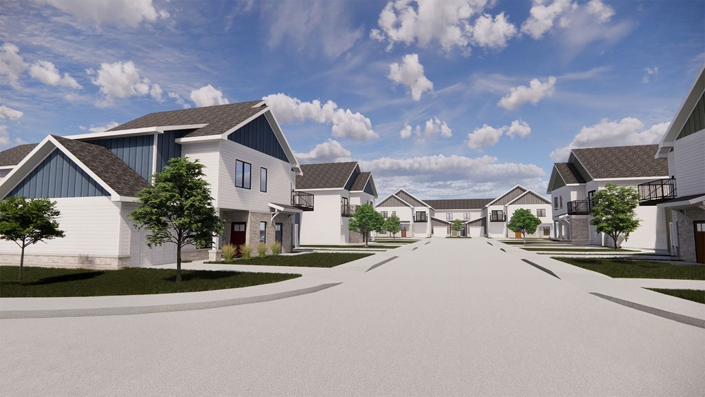 A row of houses with a street in between.