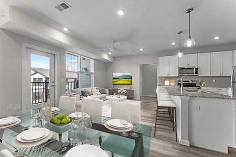 A modern dining room with a glass table set for four.