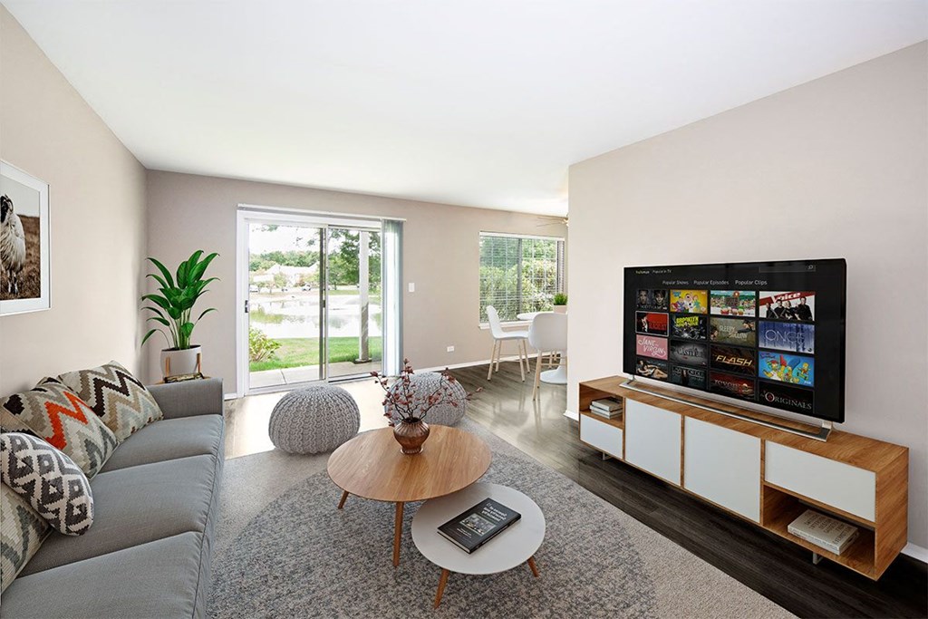 a living room with a couch and a table and a television