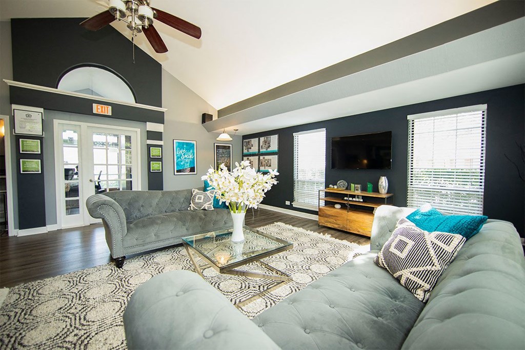 a living room with a couch and a tv
