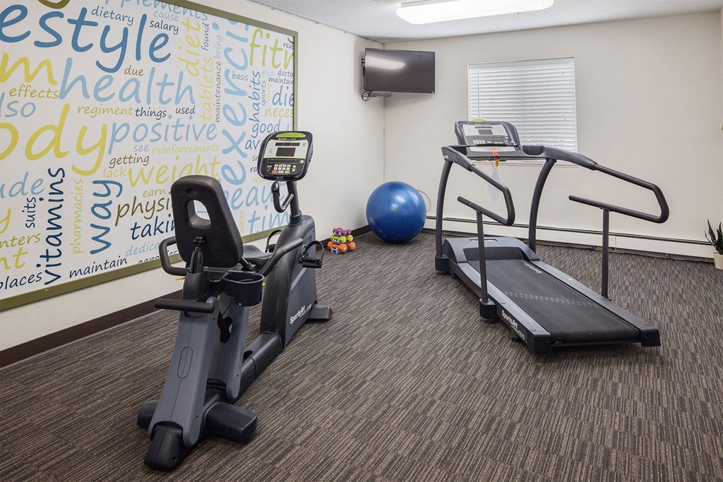 fitness room with treadmill