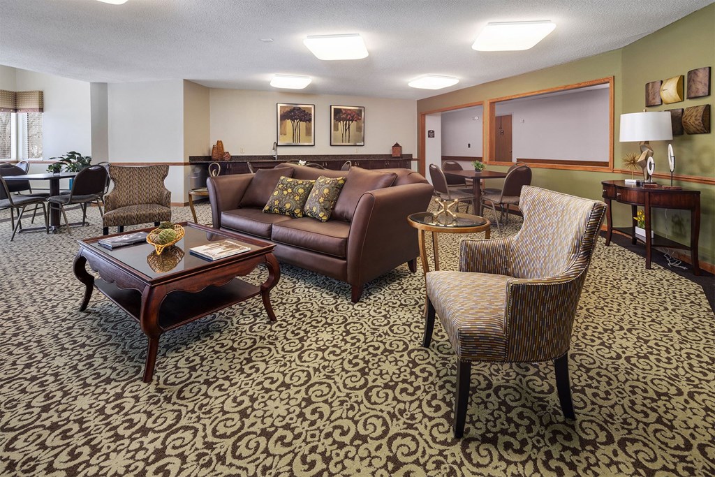 a living room with couches chairs and a table