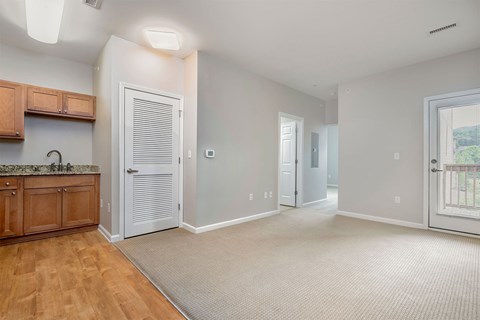 A room with a wooden cabinet and a marble countertop.