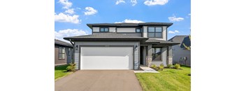 a house with a white garage door in front of it
