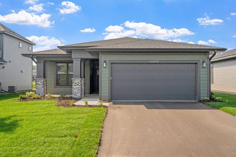 a house with a driveway and a garage door